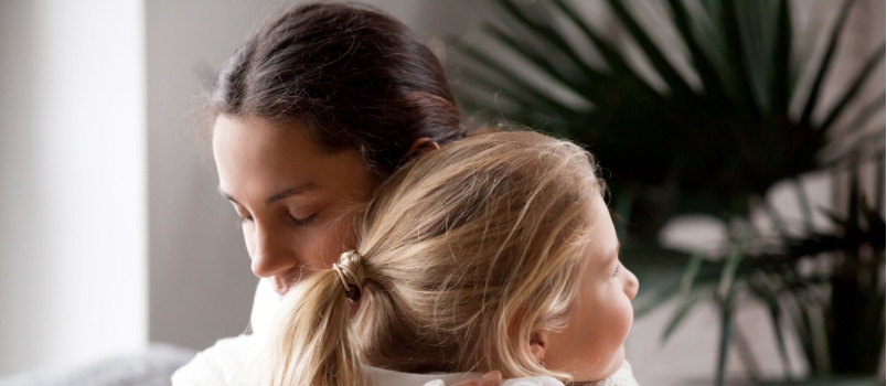 Mother and daughter hugging each other