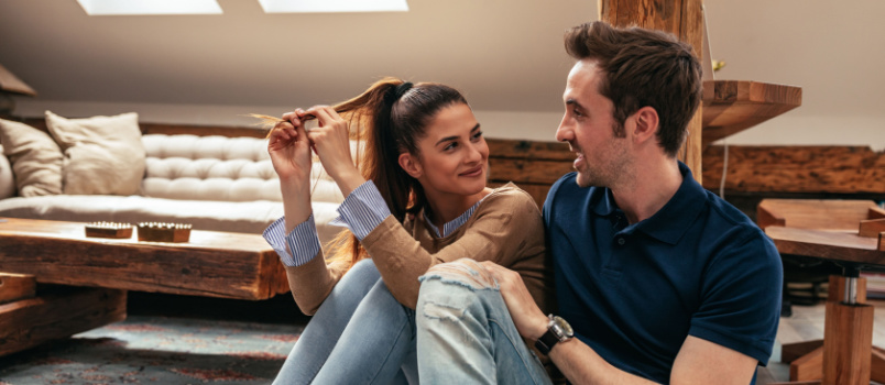 Attractive young couple talking to each other