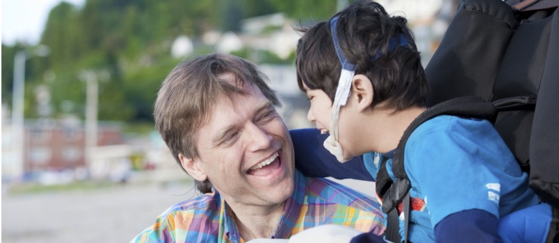 Father playing with disable son