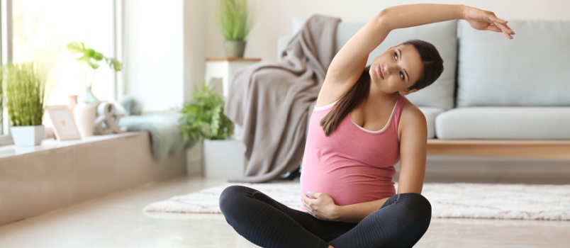 Pregnant woman doing yoga