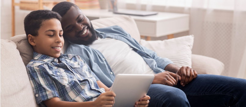 Dad and son using tablet