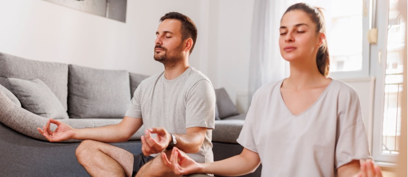 Young couple doing yoga