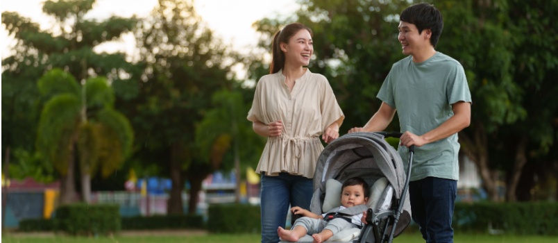 Father and Mother enjoying walking in park