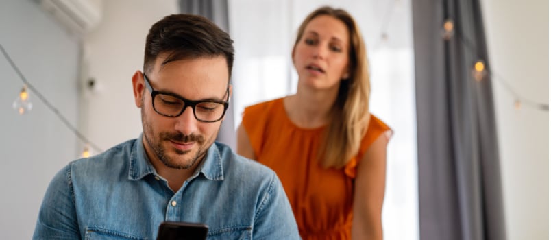 Woman spying on boyfriend