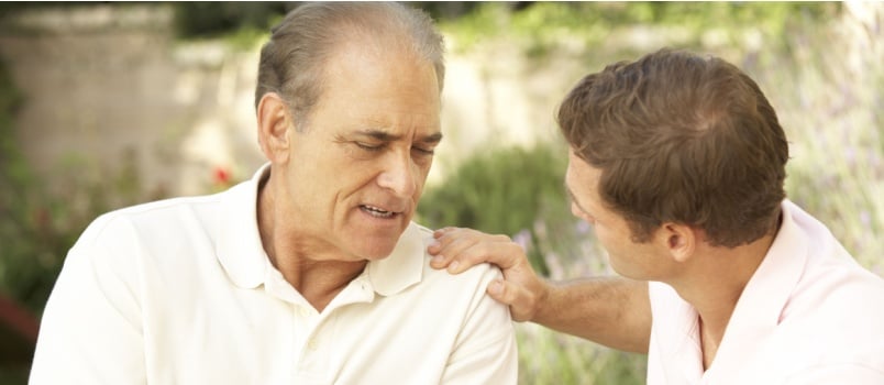 Two mature man talking to each other