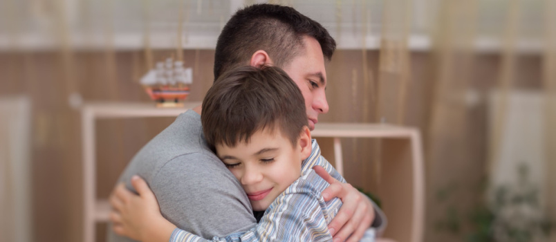 Father and son hugging each other