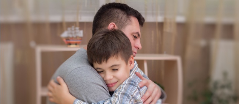 Father and son hugging each other