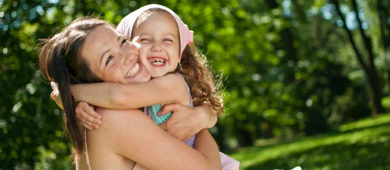 Mother and child hugging each other