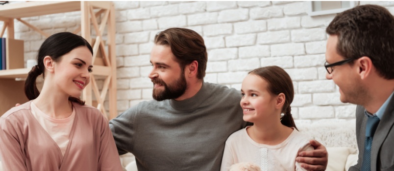 Happy family talking to psychologist