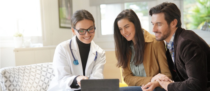 Young couple consulting doctor