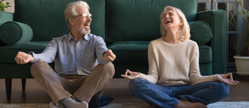 Happy couple doing yoga