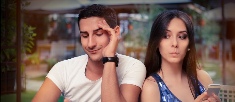 Man trying to looking into woman's cell