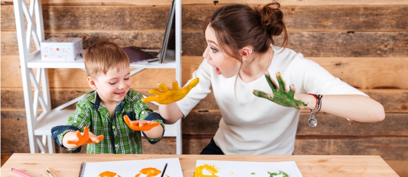 Mother and son painting together