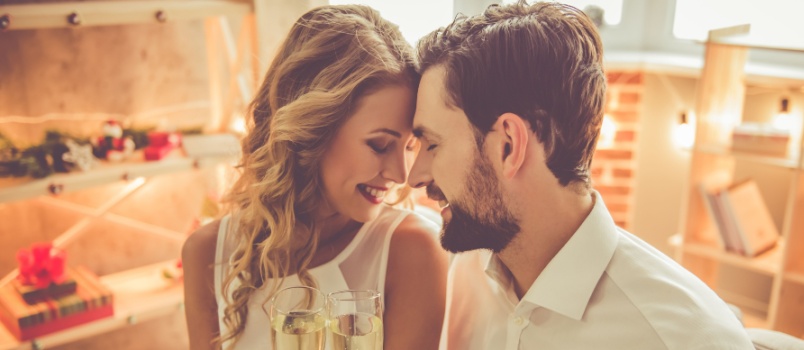 Young couple holding wine glasses