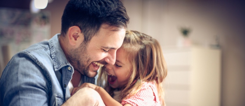 Father and daughter playing together