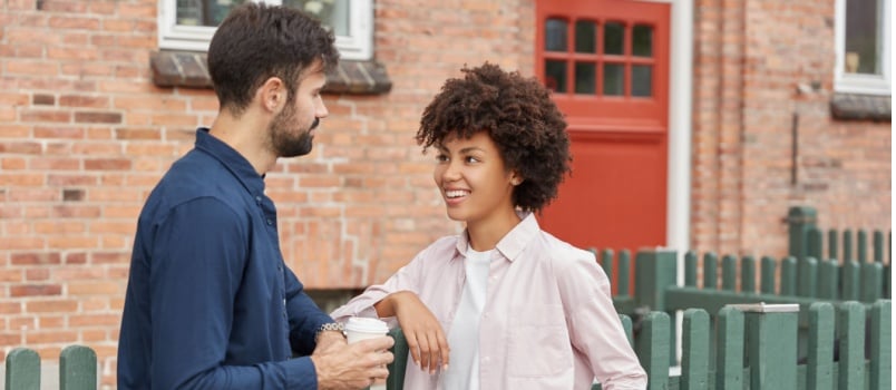 Couple standing talking to each other