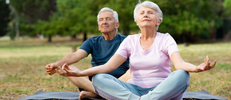 Mature couple doing yoga