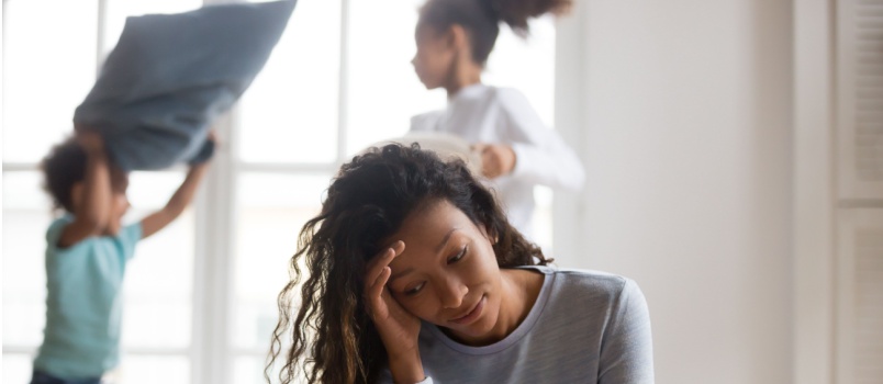 Stressed woman taking care of child