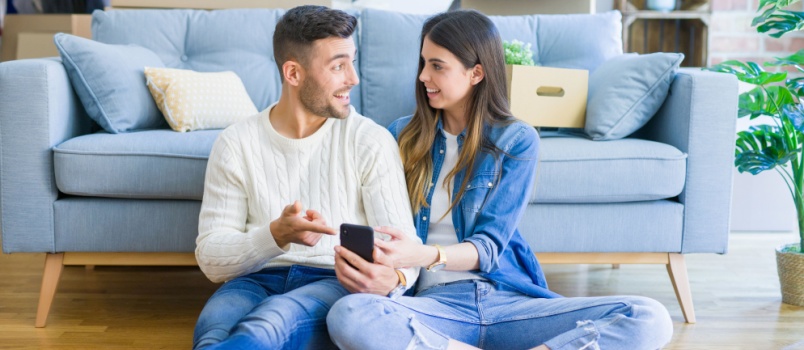 Young couple sitting on floor