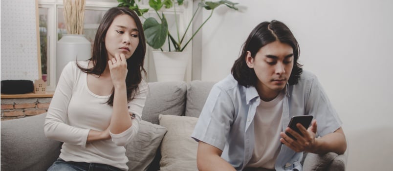 Woman looking at her boyfriend from behind