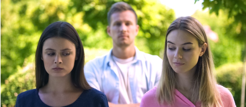 Two jealous woman looking at each other