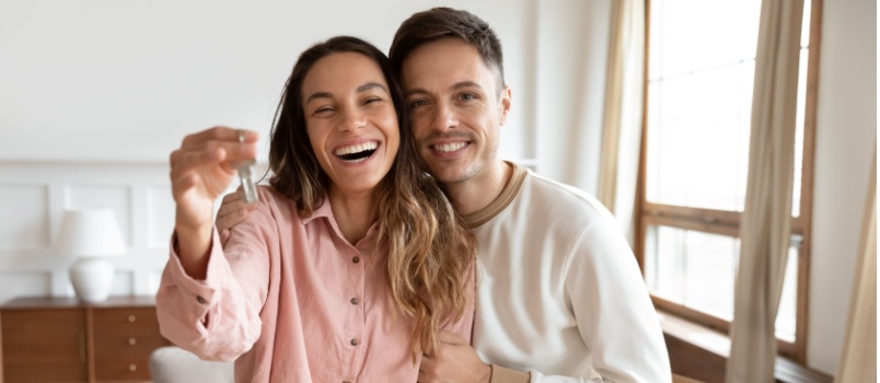 Couple holding new home keys