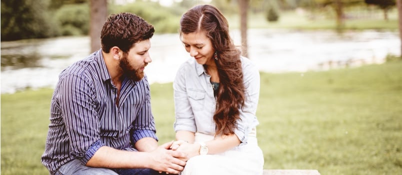 Couple holding each other hands