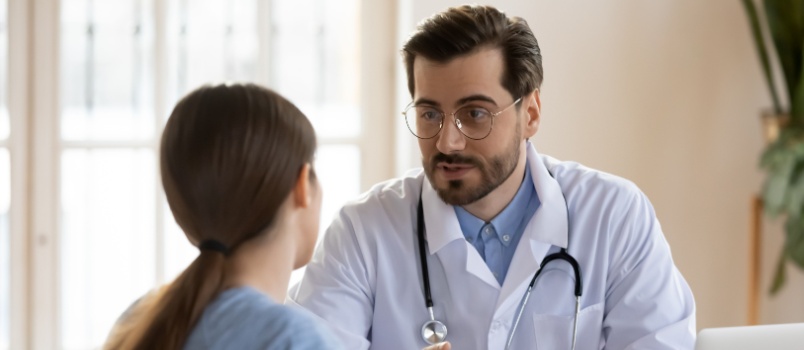 Young woman consulting doctor