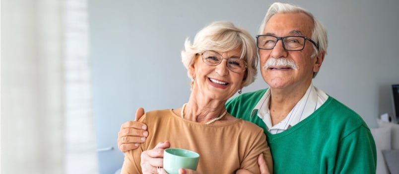 Senior man embracing the woman