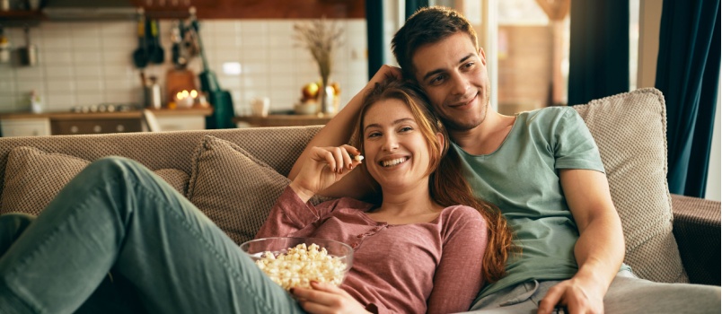 Happy couple watching movie