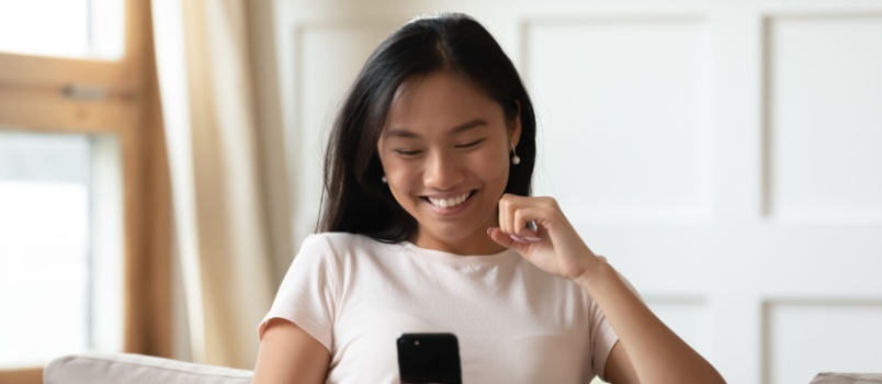 Girl being happy after seeing things on her phone