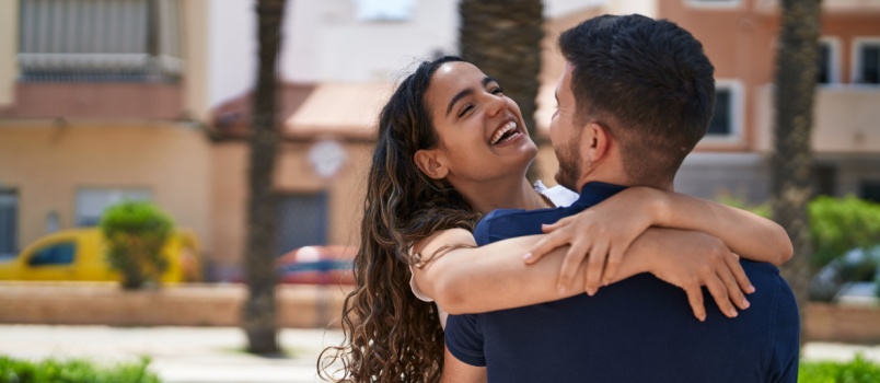 Couple laughing together and hugging