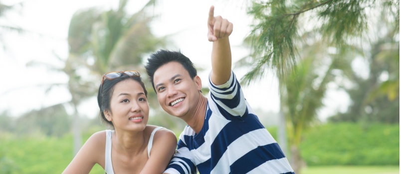 Young man pointing toward something special