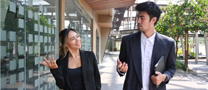 Two business colleagues talking