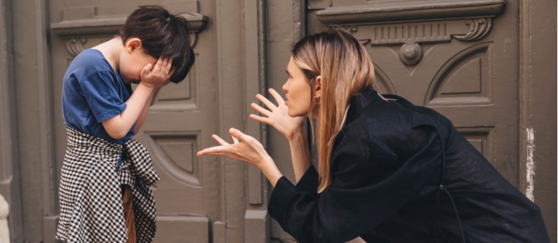 Mother scolding son on street