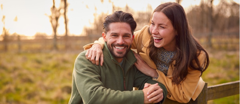 Loving couple walking through autumn