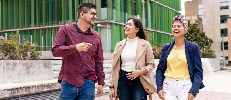Happy walking two woman and young man