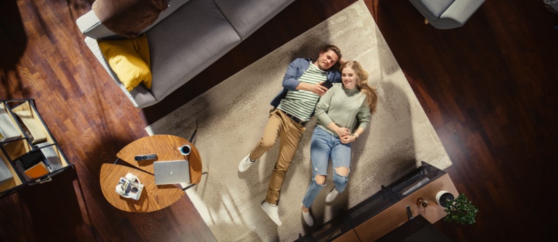 Young couple laying on bed
