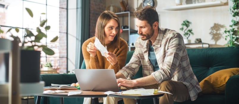 Young couple working on laptop