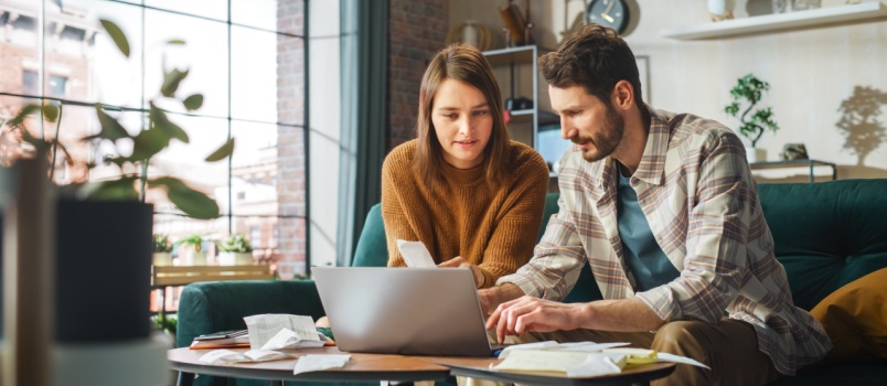 Young couple working on laptop