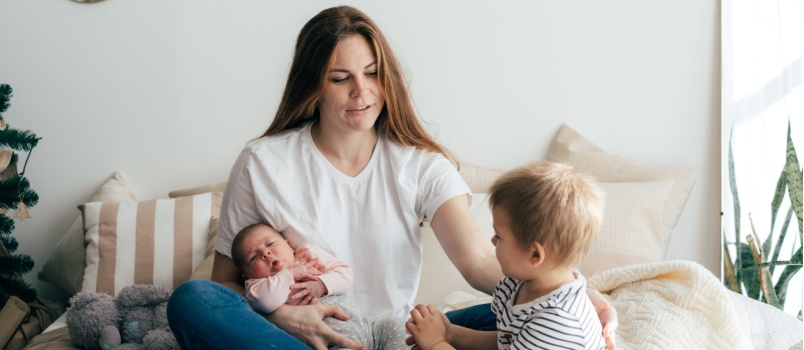 Mother taking care of two small children