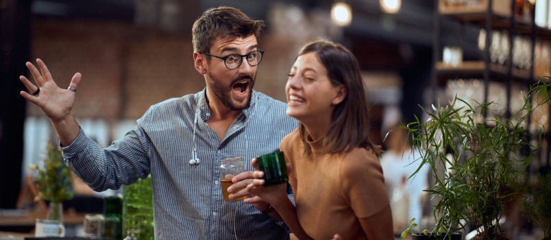 Young couple in bar having fun