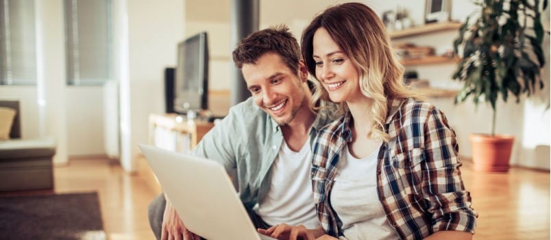 Young couple using laptop