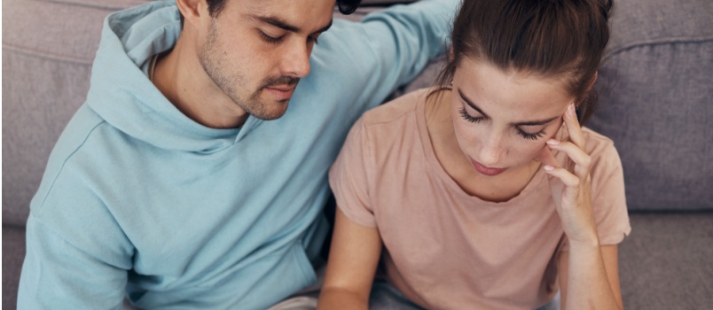 Mature couple sitting on couch