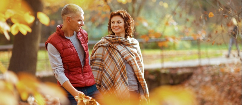 Old couple having a stroll in the park