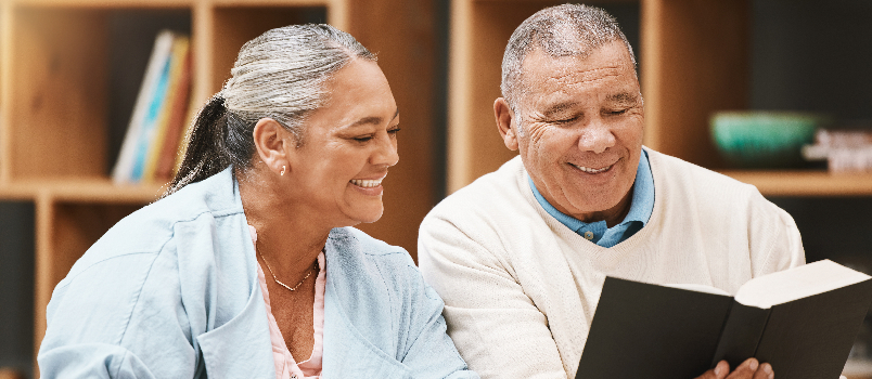 Couple reading together in a library