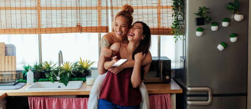 Girl hugging her girlfriend from behind