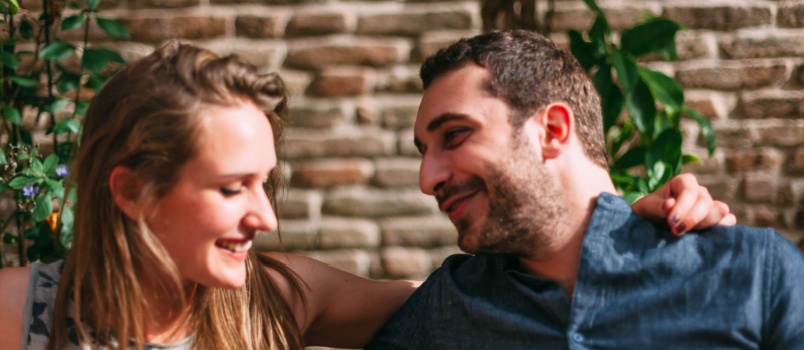 Young couple smiling looking at each other