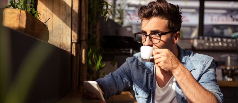 Man drinking cup of coffee