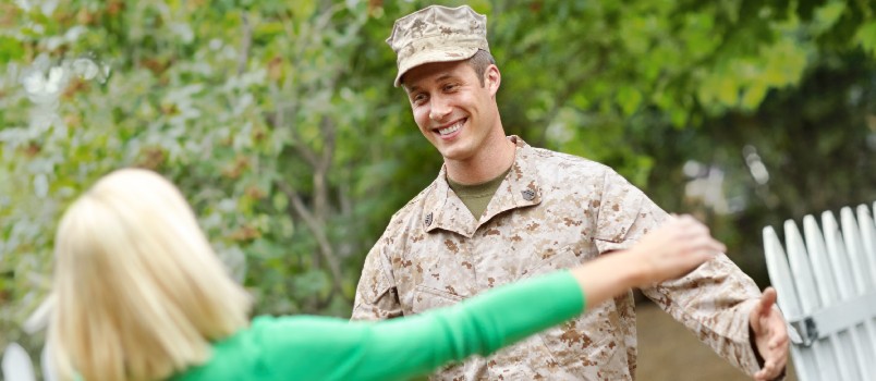 Military couple hugging each other